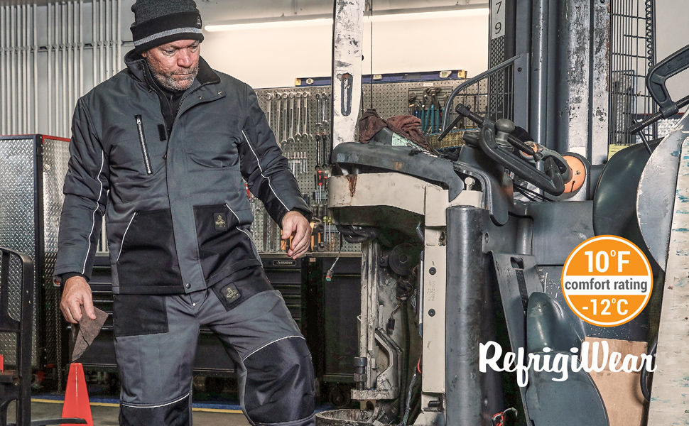 Man wearing ChillShield Jacket working in garage.